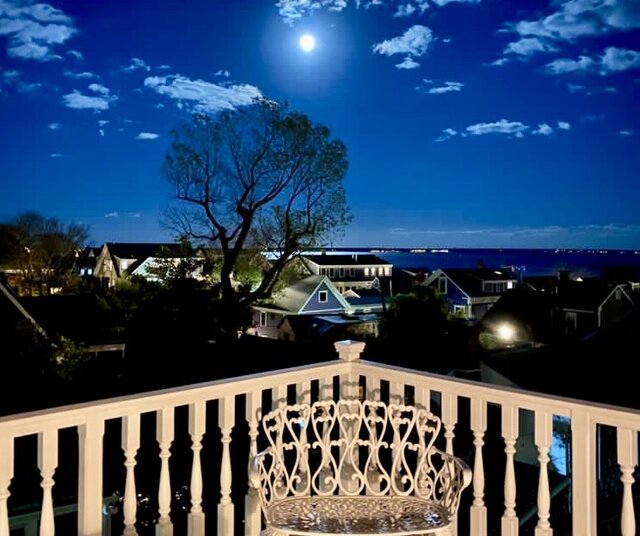 Gorgeous evening water and town views from the private roof deck of the Hatches Harbor Suite