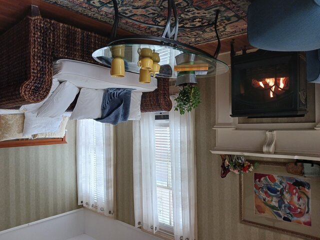 Fireplace, windows & garden view from queen bed