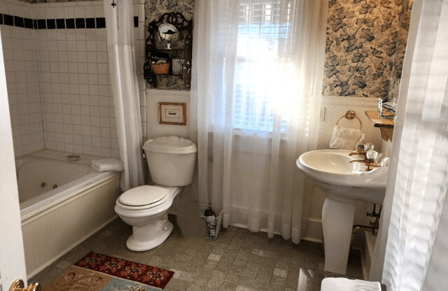In-suite bathroom has oversized jetted tub, shower & amenities