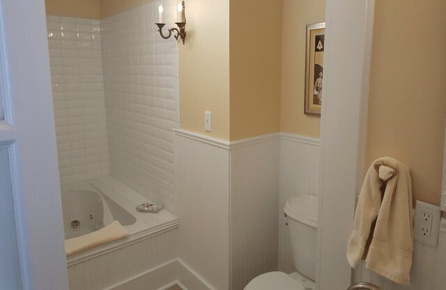 Master bath with jetted tub, shower and all supplies including robes