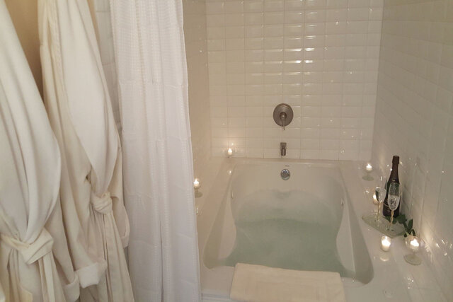 Bath has double jetted tub and full shower