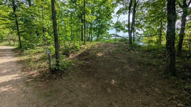 Image 6 for 77) Shaded Forest Tent Site with Lake Glimpses View