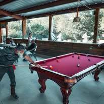 guest-playing-pool-at-pavilion-als-hideaway