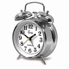 old fashion alarm clock set to 2pm