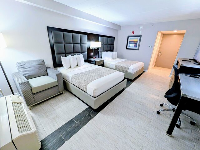 Room showing two double beds