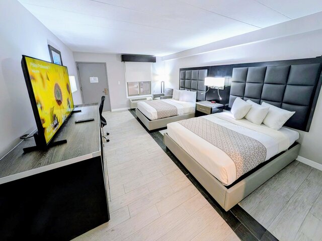 Two double beds and flat screen TV
