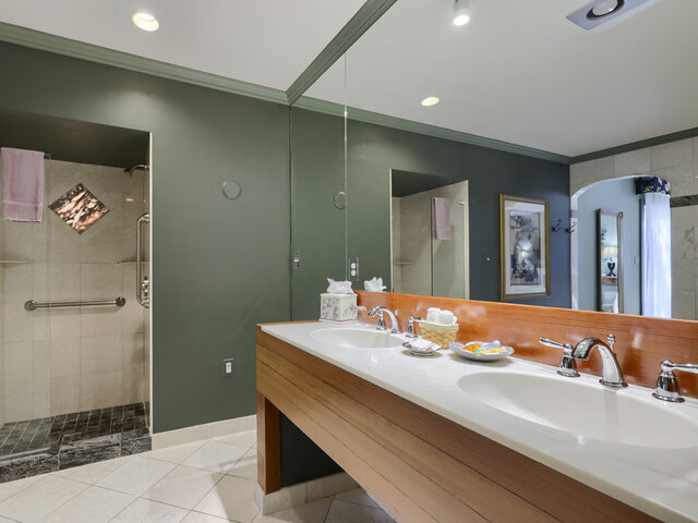 Double Vanity and Glass Shower in Spacious Bathroom