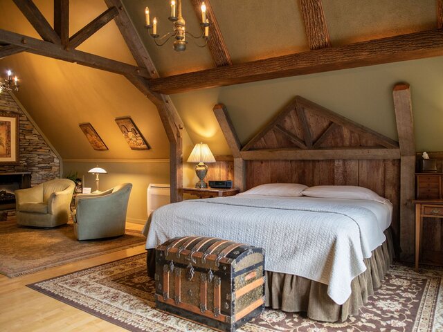 A King-sized Bed Under Exposed Wooden Beams