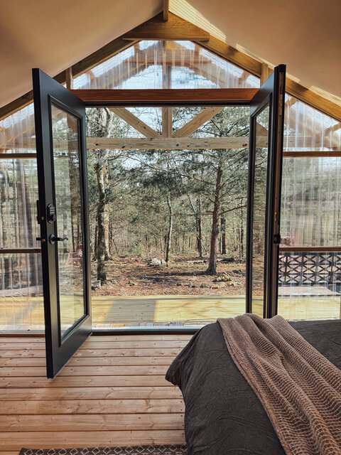 Clear front with french doors brings the outdoors in! Enjoy your coffee on the covered front porch. 