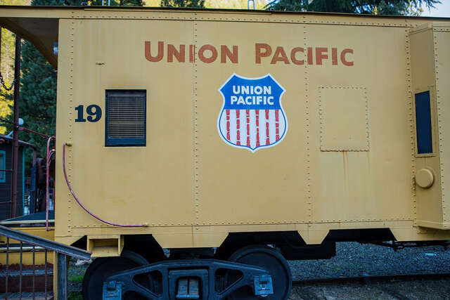 Image 1 for 19) Caboose #19 (1 Queen, 1 Twin) - Yellow Caboose