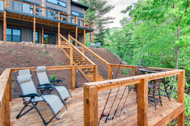 Encore Lakefront Cabin Balcony Seating with fishing poles