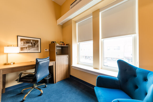hotel room with desk and chair