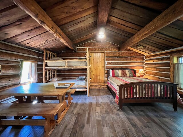 Queen Bed and Dining Area