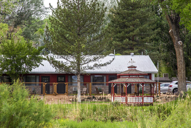 Each room as its own private patio and Adirondack chairs